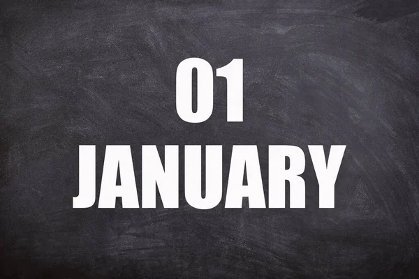 01 January text with blackboard background for calendar. And January is the first month of the year