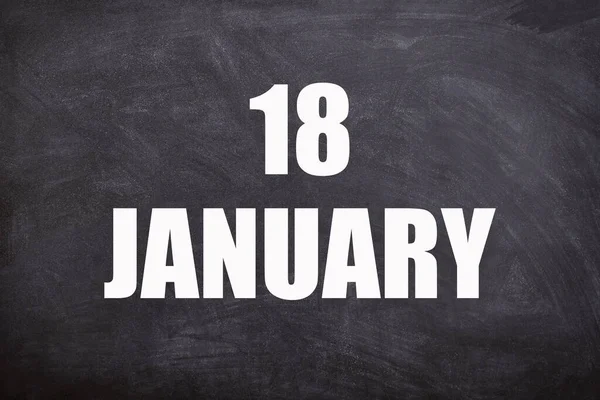 18 January text with blackboard background for calendar. And January is the first month of the year.