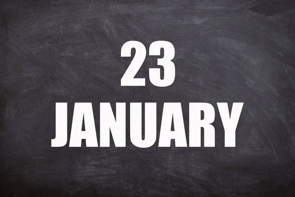 23 January text with blackboard background for calendar. And January is the first month of the year.