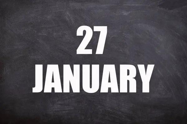 27 January text with blackboard background for calendar. And January is the first month of the year.