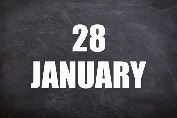 28 January text with blackboard background for calendar. And January is the first month of the year.