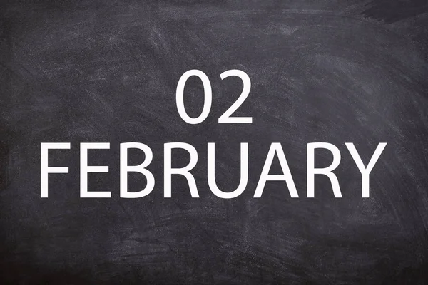 02 February text with blackboard background for calendar. And February is the second month of the year.