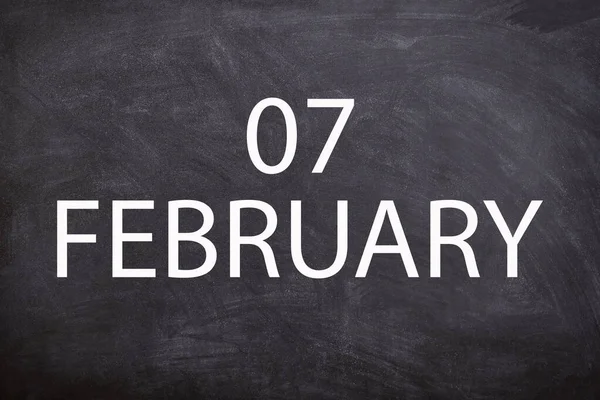 07 February text with blackboard background for calendar. And February is the second month of the year.