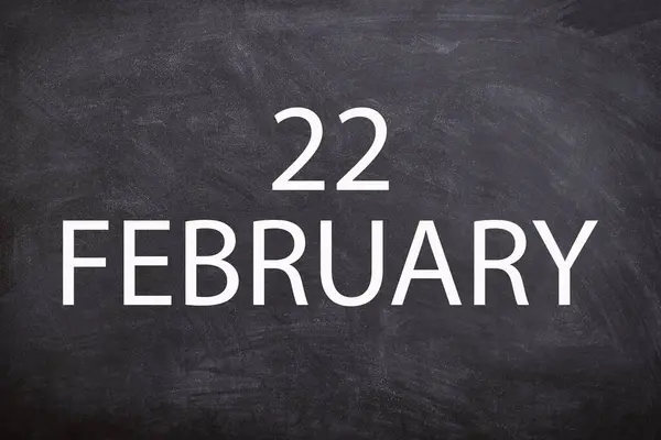 22 February text with blackboard background for calendar. And February is the second month of the year.