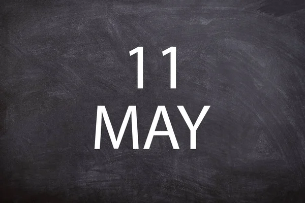 11 May text with blackboard background for calendar. And may is the fifth month of the year