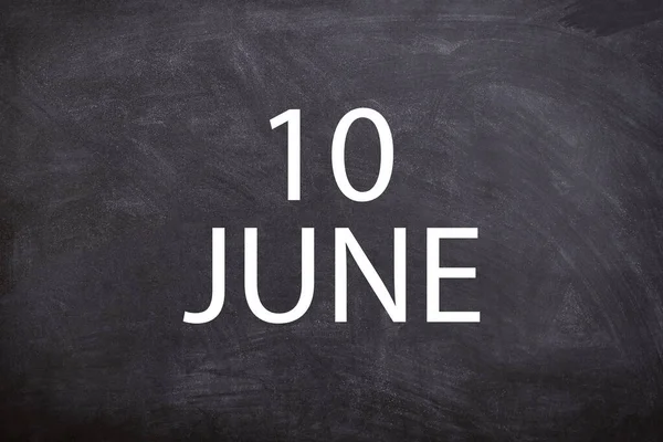 10 June text with blackboard background for calendar. And June is the sixth month of the year