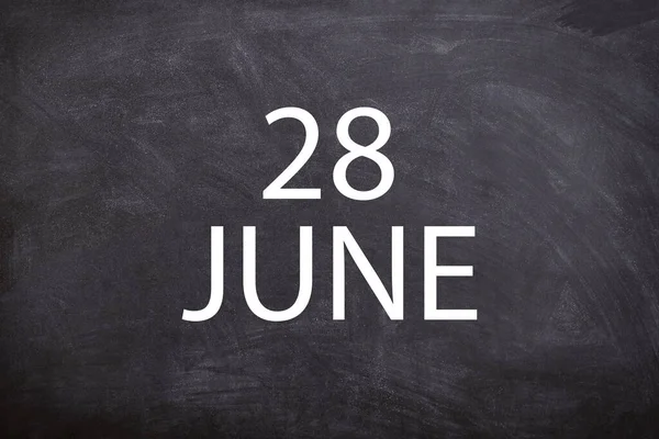 28 June text with blackboard background for calendar. And June is the sixth month of the year