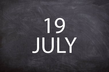 19 July text with blackboard background for calendar. And July is the seventh month of the year