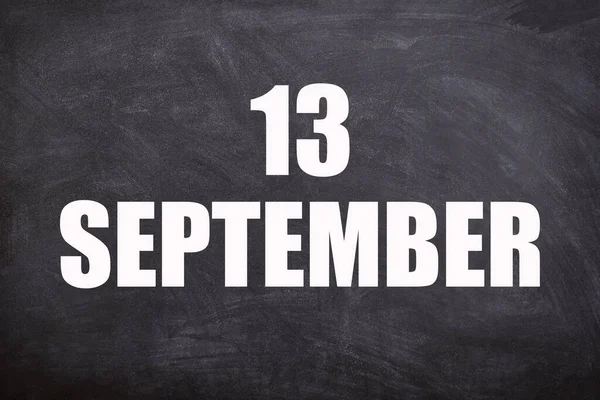 13 September text with blackboard background for calendar. And September is the ninth month of the year