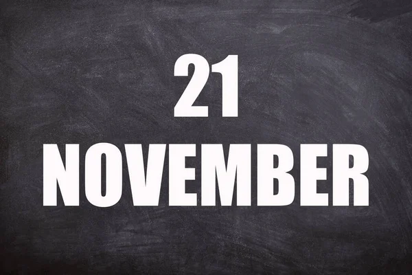 21 November text with blackboard background for calendar. And November is the eleventh and penultimate month of the year