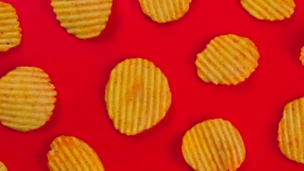 Rotating Red Corrugated Ruffled Potato Chips High Quality Footage — Stock Video