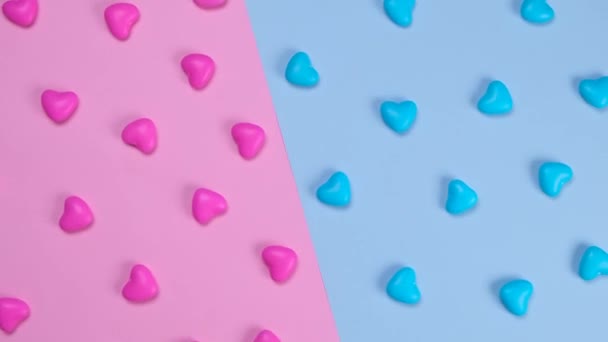 Rotating Pink Blue Background Heart Shaped Candies Concept Gende Party — Vídeo de Stock