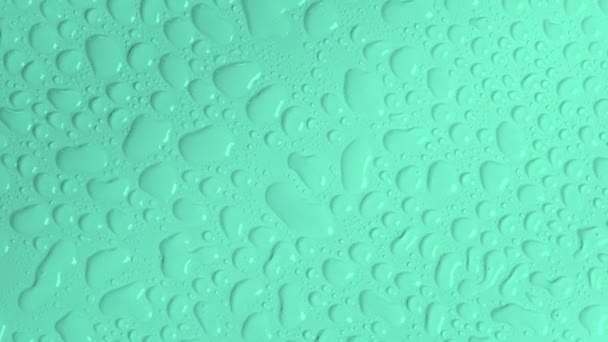 Rotating Turquoise Green Pastel Background Water Drops Transparent Cosmetic Gel — Stockvideo