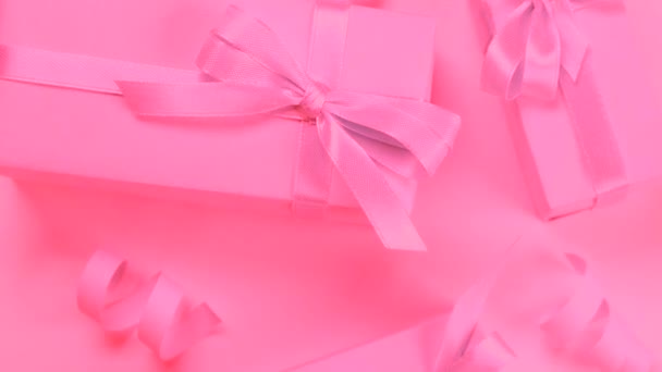 Rotating Background Pink Gift Boxes Pink Bows Pink Background Top — Stock Video