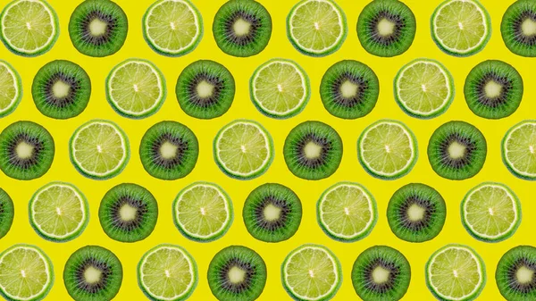 Colorful Pattern Ripe Lime Kiwi Slices Yellow Background — Stock Photo, Image
