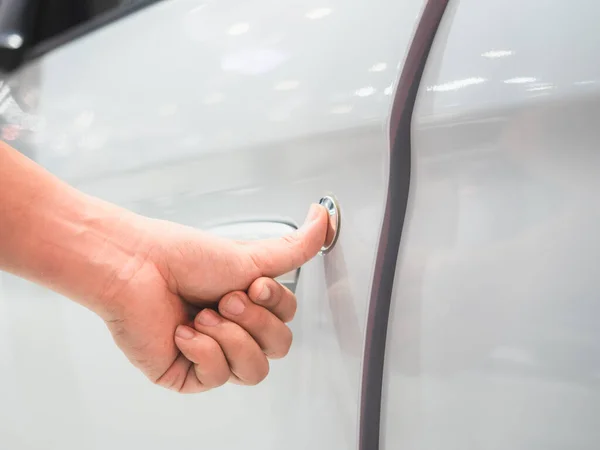 Closeup hand scan door car white color and blur event motor show concept