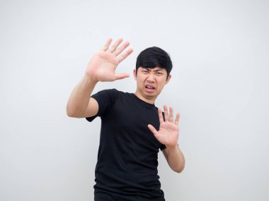 Man show hand close his face feeling afraid and shy