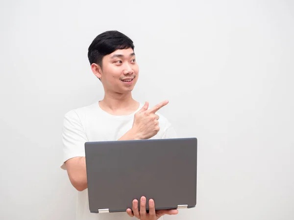 Asian Man Cheerful Holding Laptop Point Finger Space White Background — Stockfoto