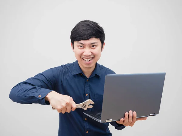 Asian Man Holding Adjustable Wrench Fixed Laptop His Hand Confident — Zdjęcie stockowe