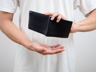 Crop shot of man hand shake empty wallet find money concept