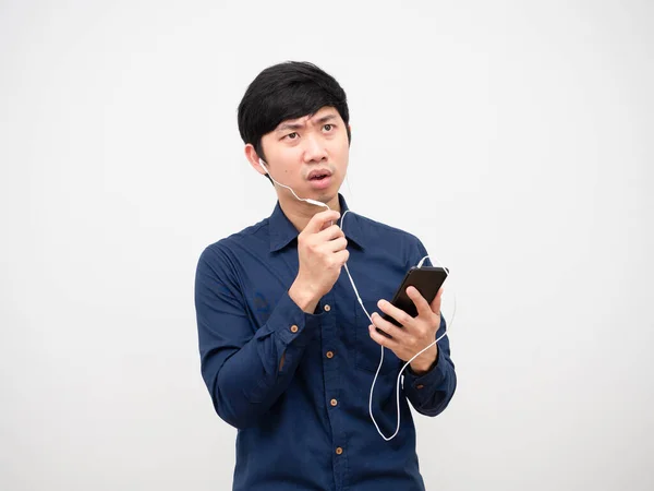 Asian Man Sreious Face Talking Earphone Holding Mobiilephone Hand White — Stockfoto