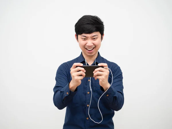 Asian Man Using Earphone Play Game Mobilephone Feeling Fun White — ストック写真