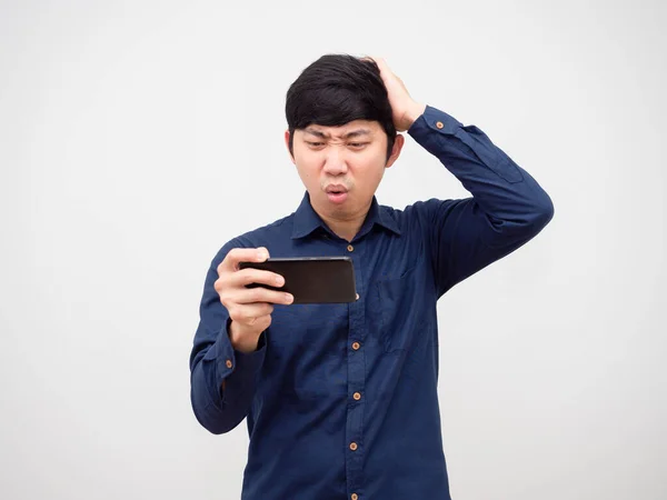 Asian Man Playing Game Mobilephone Feeling Bored Touch His Head — Stockfoto