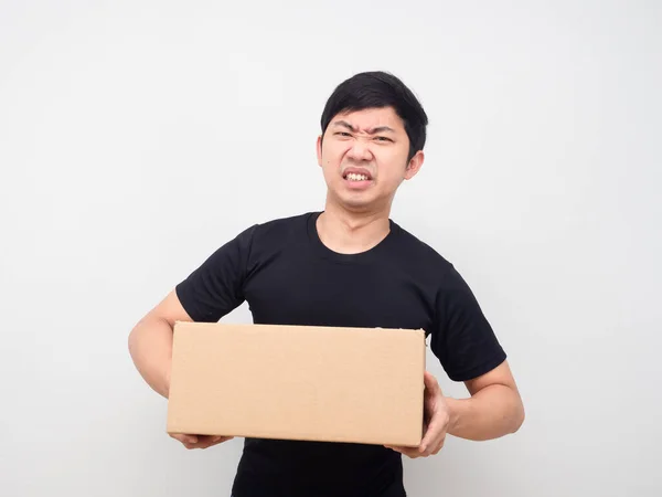 Man Holding Parcel Box Feeling Heavy White Background —  Fotos de Stock