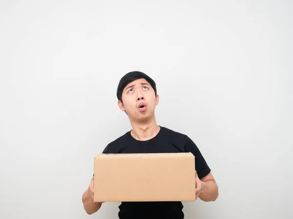 Man Holding Parcel Box Feeling Amazed Looking Copy Space — Stock Fotó
