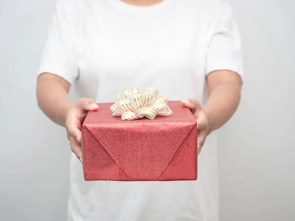 Woman Hand Giving Red Gift Box White Background Crop Shot — 스톡 사진