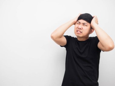 Man feeling headache and looking at copy space