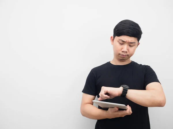 Asian Man Holding Tablet Looking His Watch Copy Space — ストック写真