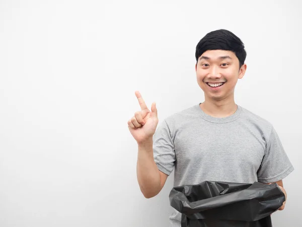 Man Holding Garbage Smiling Point Finger Copy Space — Stockfoto