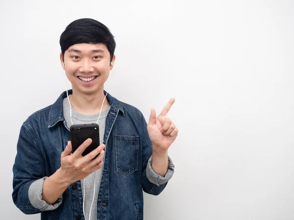 Asian Man Jeans Suit Smiling Holding Mobile Phone Using Earphone — ストック写真