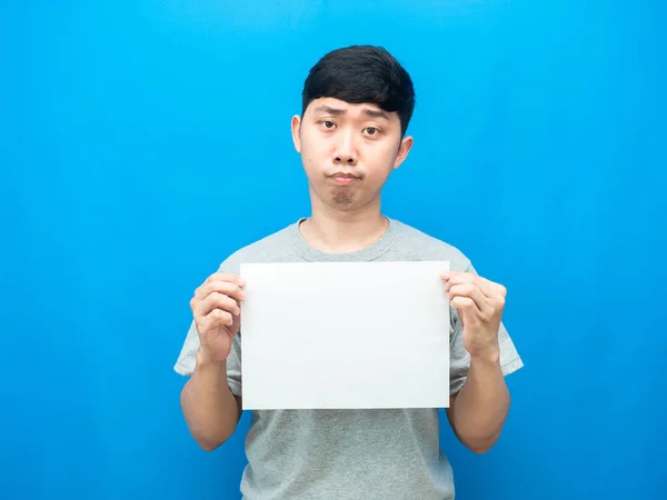 Man Holding White Empty Paper Doubt Emotion Blue Background — Stockfoto