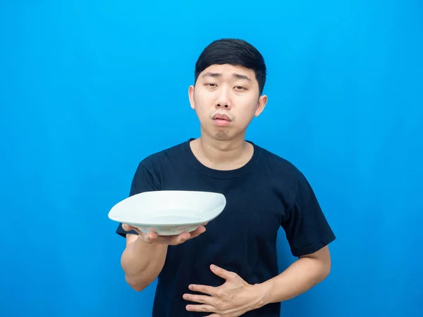 Man Holding Dish Touch Belly Feeling Hungry Blue Background — Fotografia de Stock