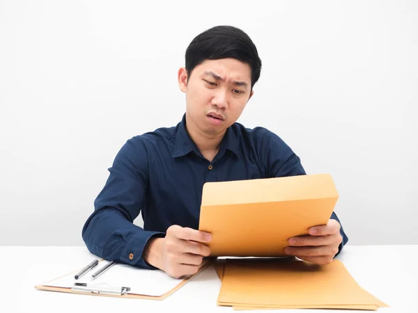 Asian Man Sit Table Looking Document Envolope His Hand Feeling — Fotografia de Stock