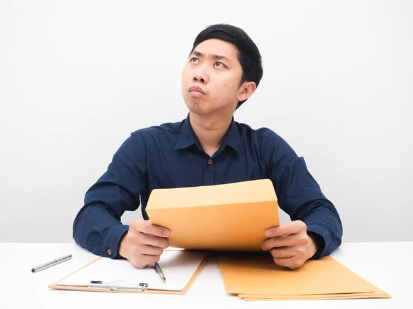 Man Holding Document Envolope Thinking Something His Workplace — Foto de Stock