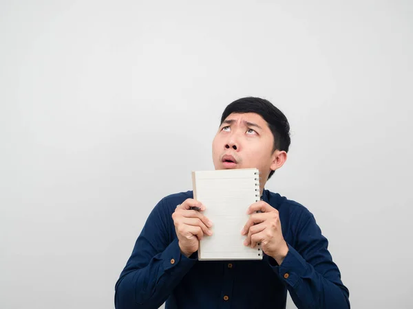 Man Holding Paper Notebook Feeling Shocked Looking Copy Space — Stockfoto