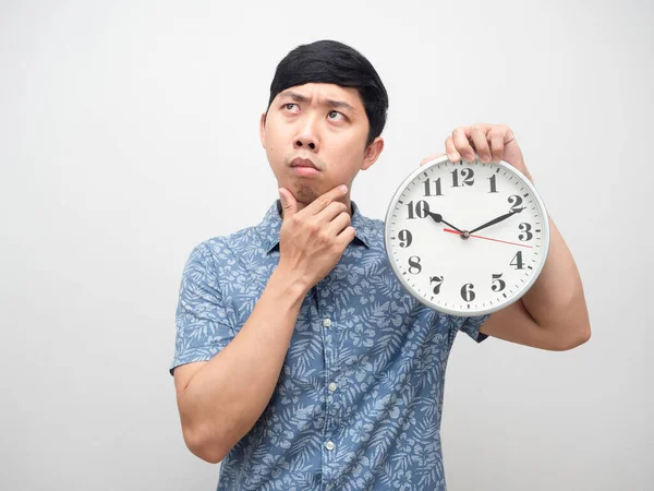 Young Man Feel Confused Thinking Something Holding Analog Clock Isolated — Fotografia de Stock