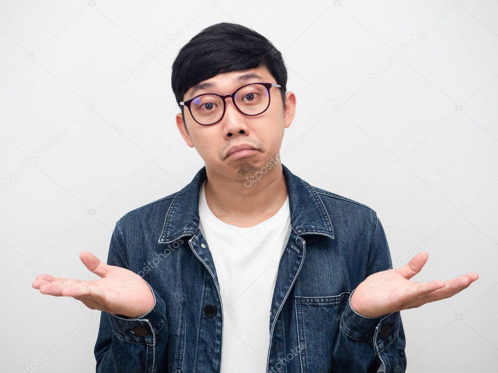 Man wearing glasses confused face gesture I don't know,Man jeans shirt doubt