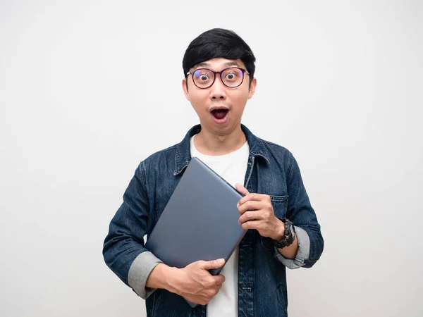 Young Businessman Jeans Shirt Wearing Glasses Holding Laptop Amazed Emotion — Zdjęcie stockowe