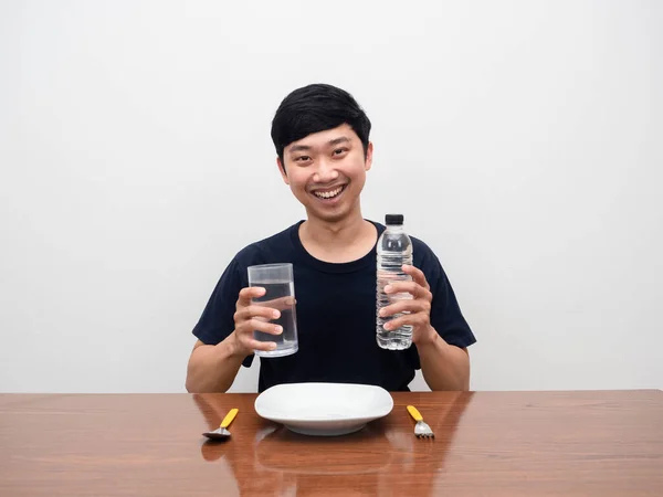Positive Man Smile Holding Water Bottle Sit Table Dish Cutlery — Fotografia de Stock