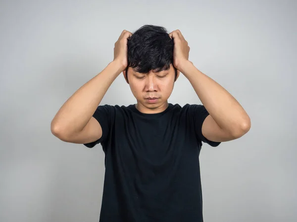 Asian man sadness hold his head portrait