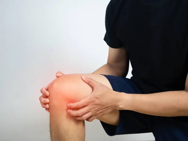 Man Kneel Hold His Knee Feels Hurt Sport White Background — Stok fotoğraf