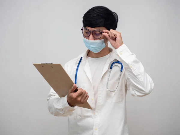 Doctor looking at check list board white background