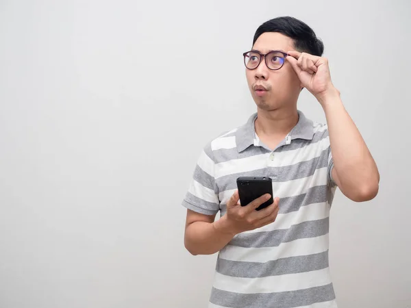 Asian Man Striped Shirt Wearing Glasses Hold Smartphone Feels Excited — Zdjęcie stockowe