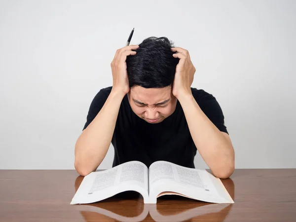 Asian Man Feels Headache Reading Book Table — Fotografia de Stock