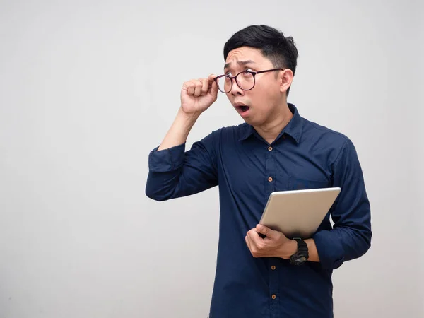 Young Businessman Feels Shocked Holding Tablet Gesture Take Glasses Looking — Stock fotografie