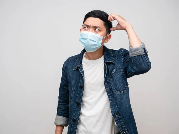 Man Jeans Shirt Wear Medical Mask Scratch Head Feels Doubt — Foto de Stock